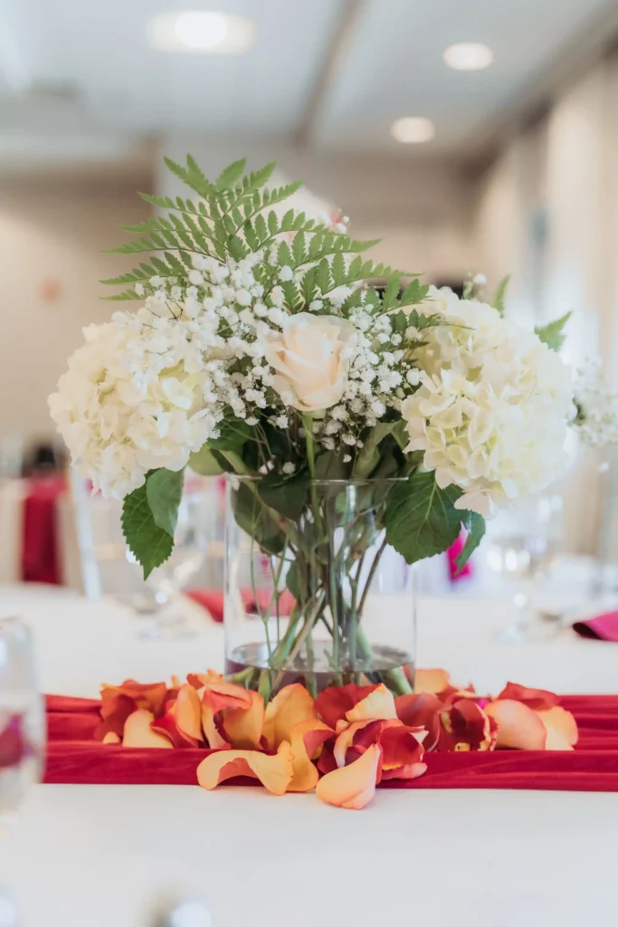 white hydrangea rose centerpiece red runner table