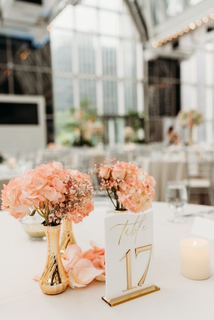 Table 17 with gold bud vases and peach hydrangeas by Regal Event Decor