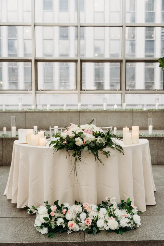 Memorial remembrance table with framed photos and candles by Regal Event Decor