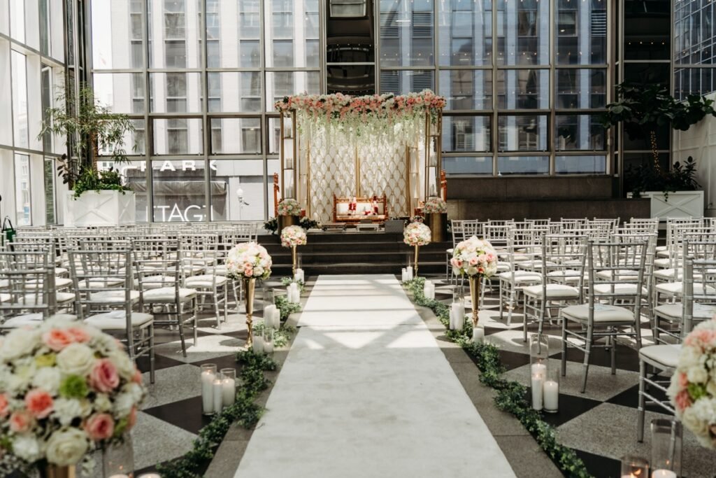 Sweetheart table with white and blush florals and candles by Regal Event Decor