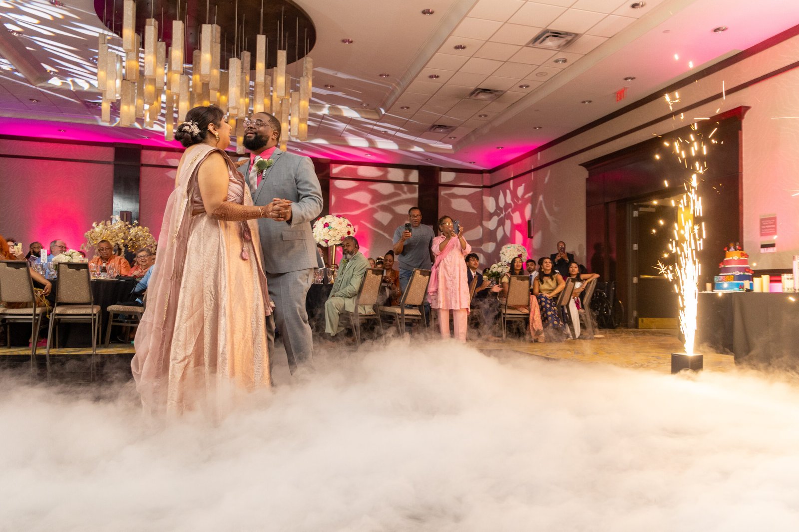 First dance under cold sparks and low fog at The Westin Mount Laurel wedding reception, decor by Regal Event Decor
