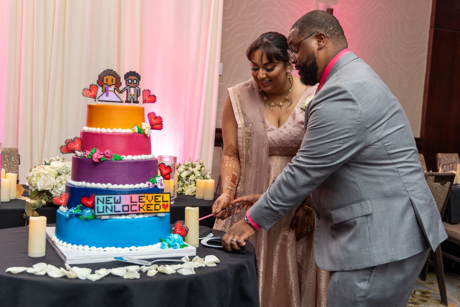 Cake cutting moment at The Westin Mount Laurel wedding reception, styled by Regal Event Decor